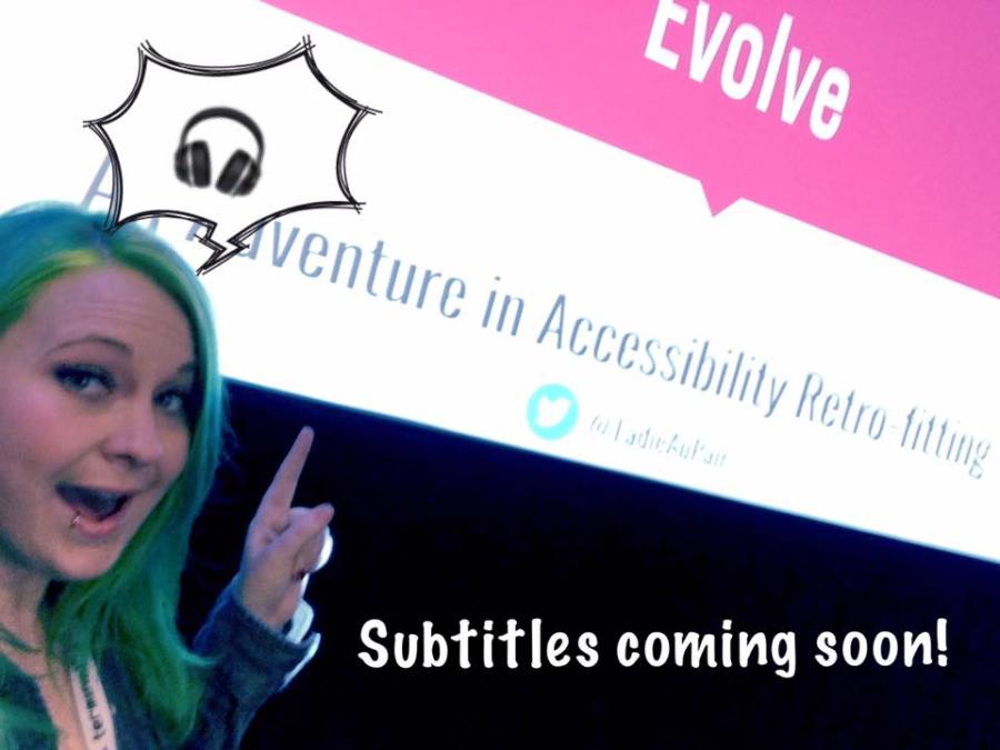 Tara pointing at her presentation with the caption "Subtitles coming soon"